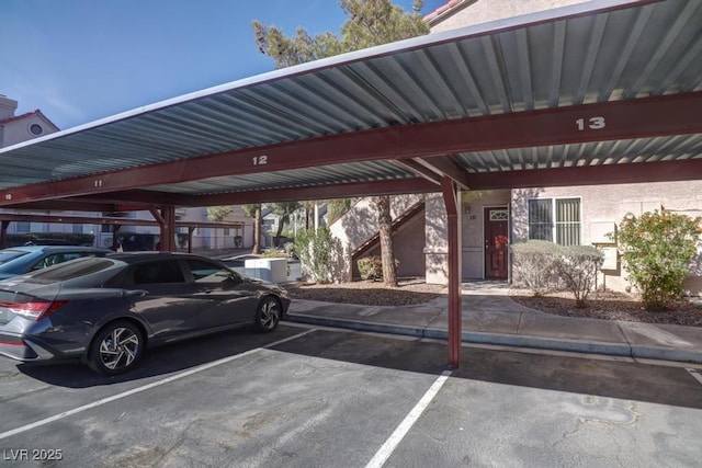 view of parking / parking lot featuring a carport