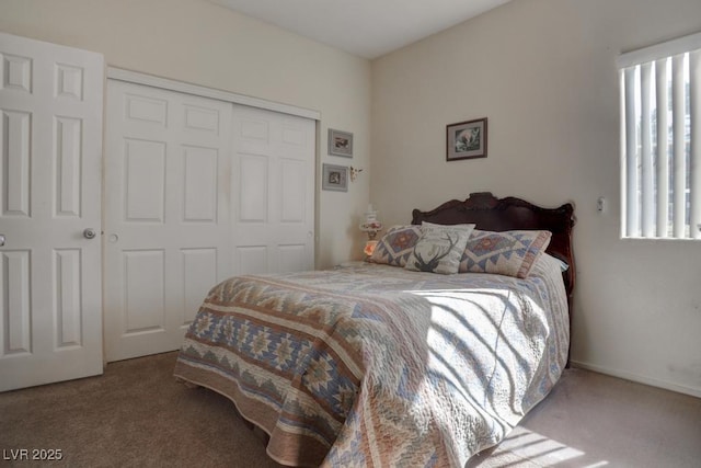 carpeted bedroom with multiple windows and a closet