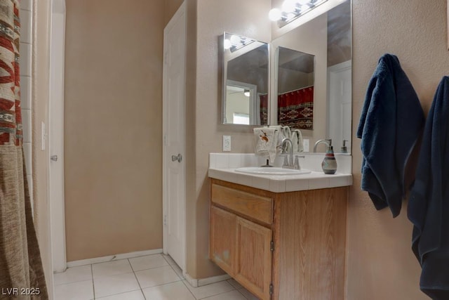 bathroom with vanity and tile patterned floors