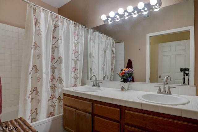 bathroom with shower / bath combo and vanity