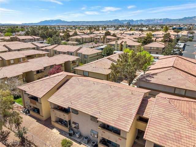 birds eye view of property with a mountain view