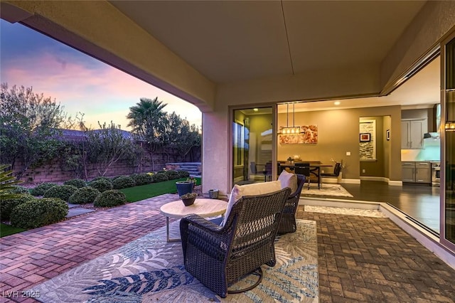 view of patio terrace at dusk