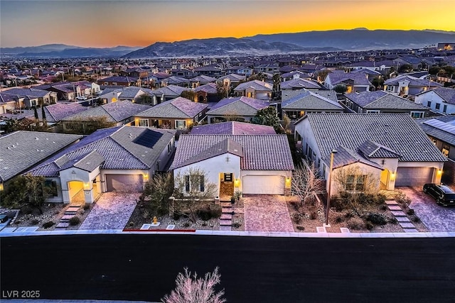 aerial view at dusk with a mountain view