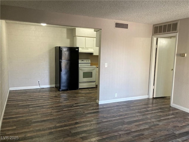 kitchen with dark wood-type flooring, white cabinets, black fridge, and white range with electric cooktop