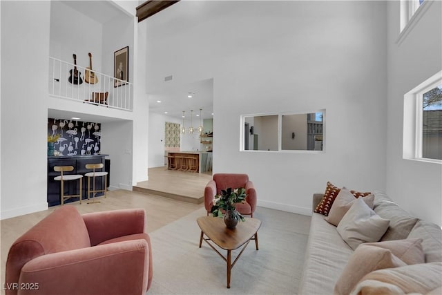 living room featuring a high ceiling