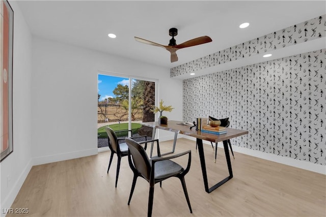 dining space with ceiling fan and light hardwood / wood-style floors