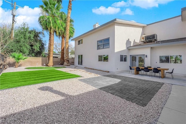 back of house with cooling unit and a patio area