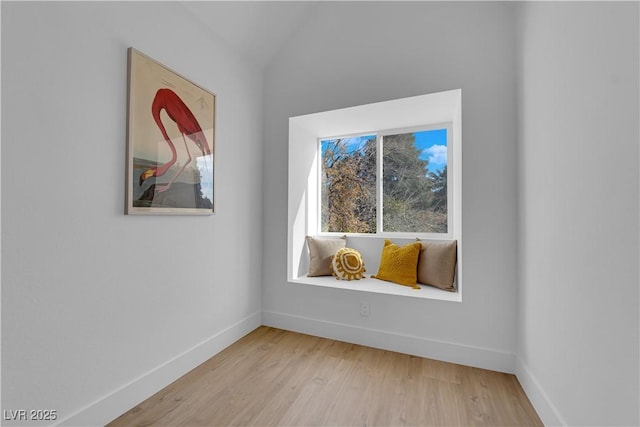 empty room with light hardwood / wood-style flooring