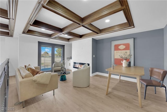 living room featuring coffered ceiling, light hardwood / wood-style floors, and beam ceiling