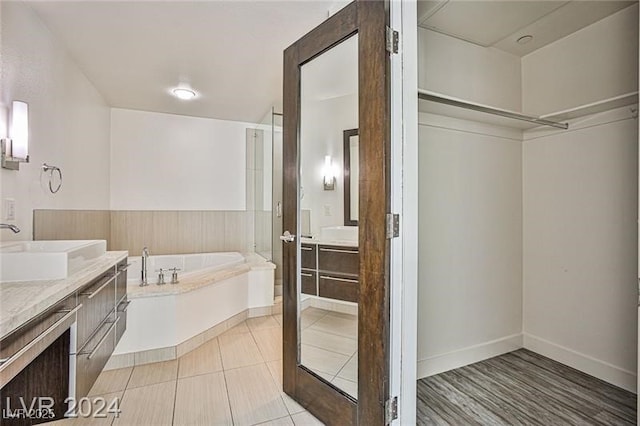 bathroom featuring a bath and vanity