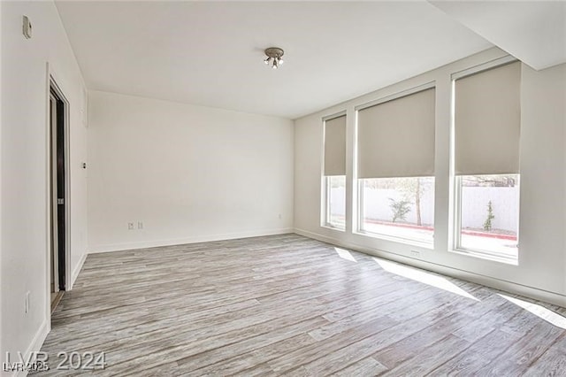 spare room featuring light hardwood / wood-style flooring