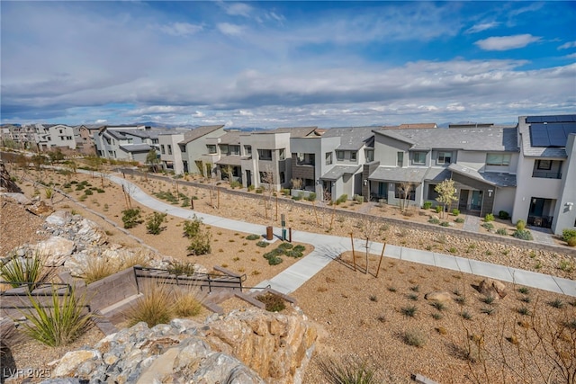 exterior space featuring a residential view and stucco siding