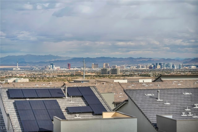 exterior space featuring a city view and a mountain view