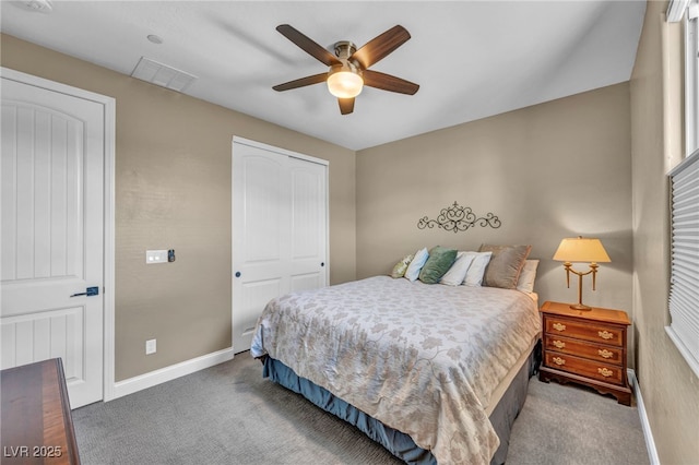 carpeted bedroom with a ceiling fan, baseboards, visible vents, and a closet