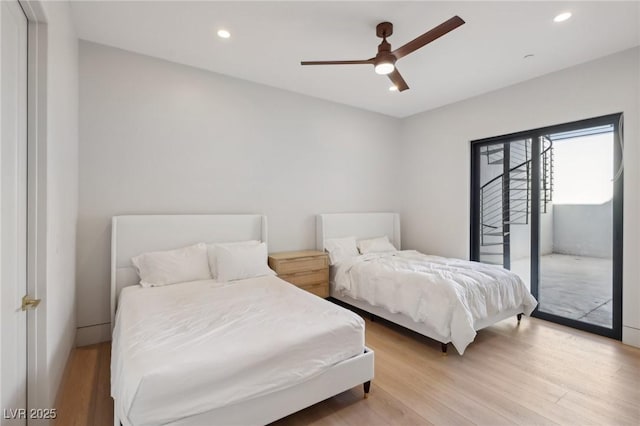 bedroom featuring light wood-type flooring, access to outside, and ceiling fan