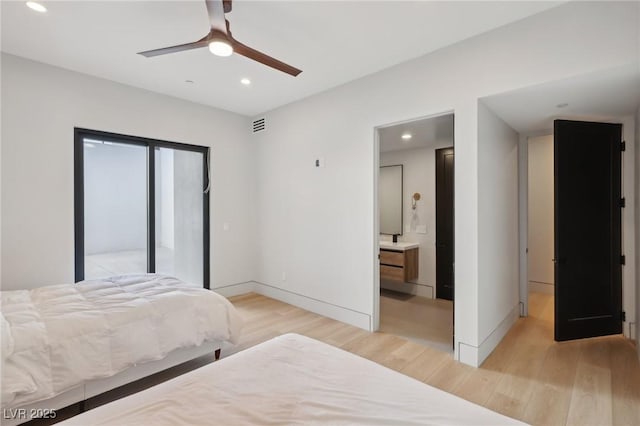 bedroom featuring light wood-type flooring, access to exterior, ceiling fan, and ensuite bath