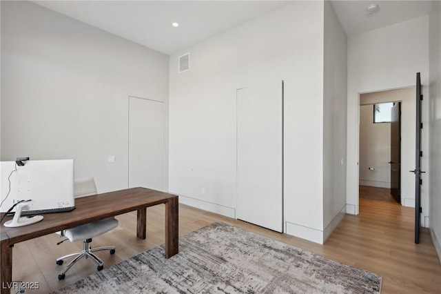 office area with light hardwood / wood-style flooring