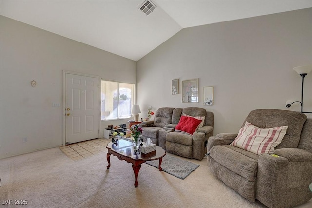 carpeted living room featuring high vaulted ceiling