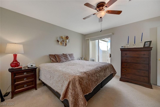 carpeted bedroom featuring ceiling fan and access to outside