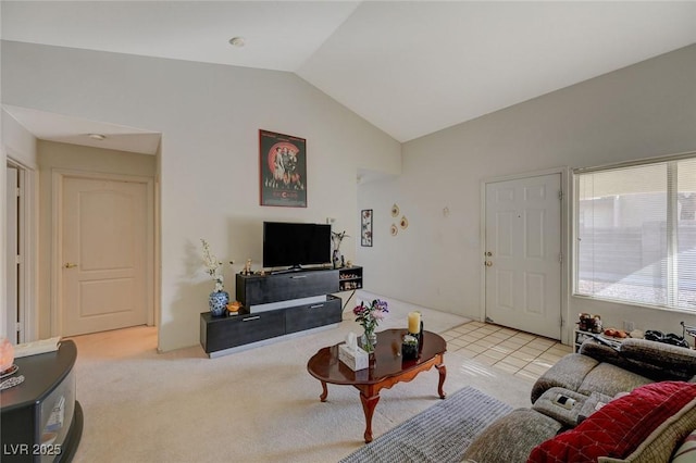 carpeted living room with vaulted ceiling