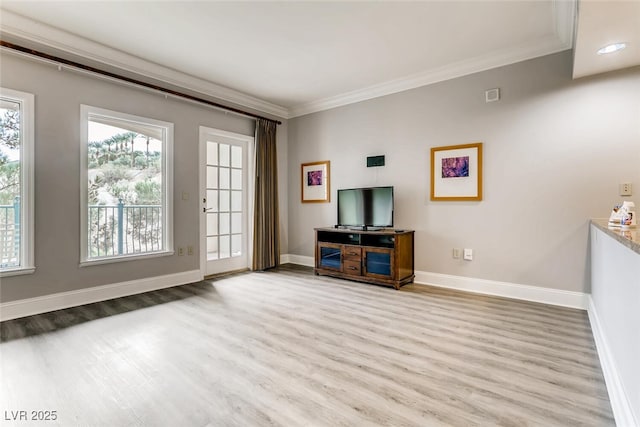 living room featuring ornamental molding and light wood-type flooring