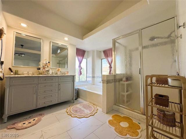 bathroom featuring separate shower and tub and vanity