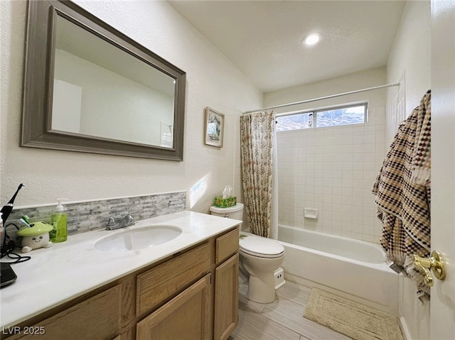 full bathroom featuring shower / bath combo with shower curtain, vanity, decorative backsplash, and toilet