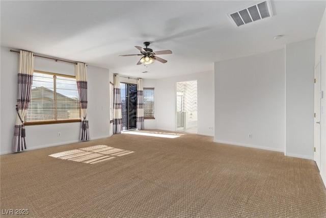 carpeted empty room featuring ceiling fan