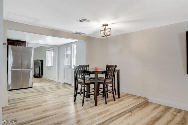 dining area with light wood-type flooring