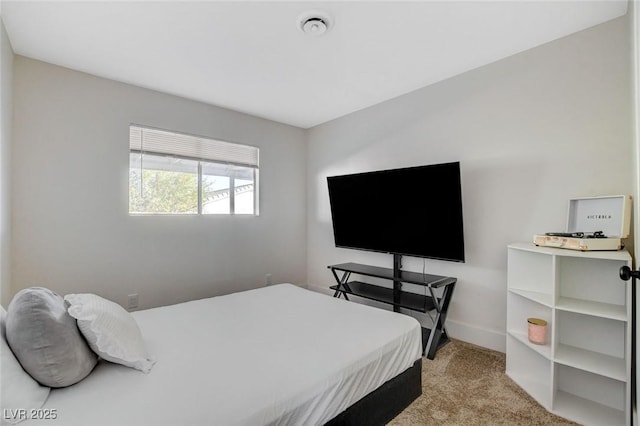 bedroom featuring light carpet