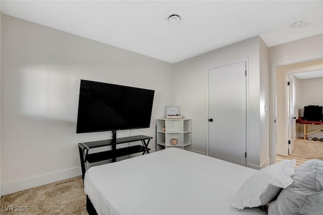 bedroom with light colored carpet