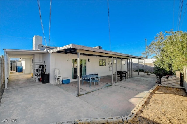 back of property with a patio area