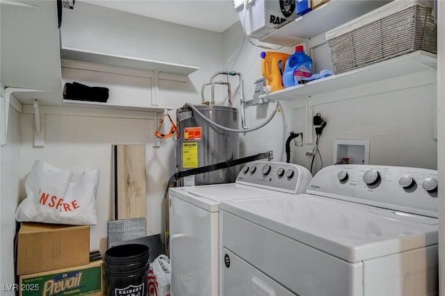 clothes washing area with washing machine and dryer and secured water heater