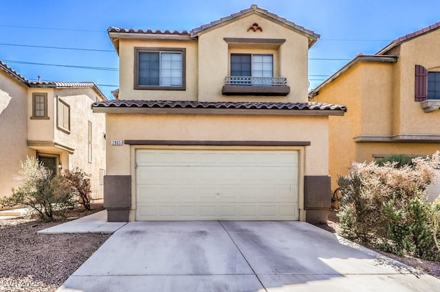 mediterranean / spanish-style home with a garage