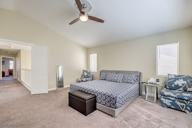 carpeted bedroom featuring ceiling fan and vaulted ceiling