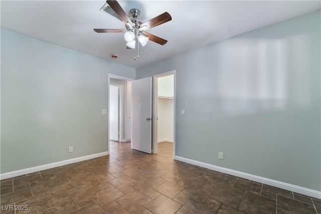 empty room featuring ceiling fan