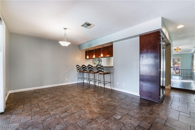 interior space featuring a kitchen bar