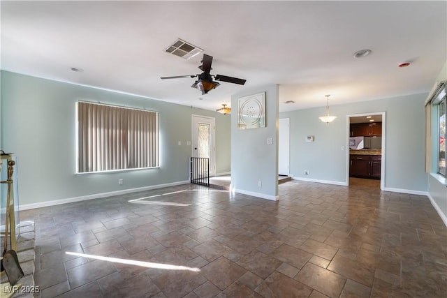 unfurnished living room featuring ceiling fan