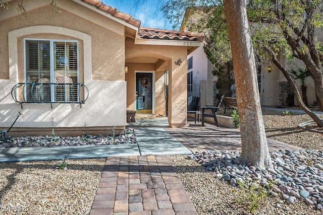 entrance to property featuring a patio area