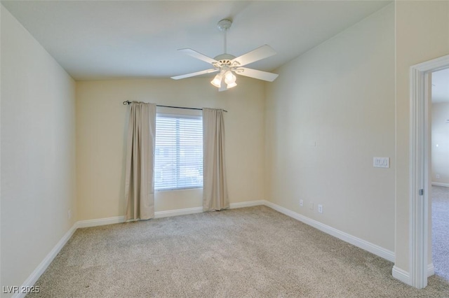 unfurnished room with ceiling fan, light colored carpet, and lofted ceiling