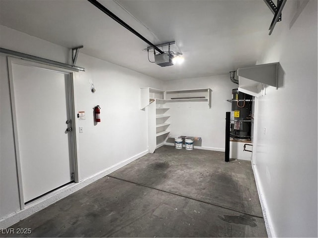garage featuring baseboards, secured water heater, and a garage door opener
