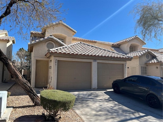 mediterranean / spanish-style home featuring a garage, a tile roof, concrete driveway, stucco siding, and ac unit