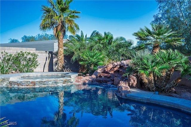 view of swimming pool featuring a pool with connected hot tub