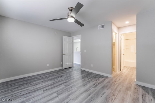 unfurnished bedroom featuring ceiling fan and light hardwood / wood-style floors