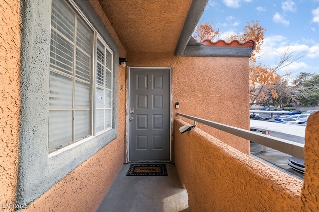 property entrance with a balcony