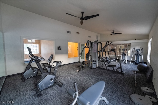 workout area featuring carpet floors, lofted ceiling, and ceiling fan