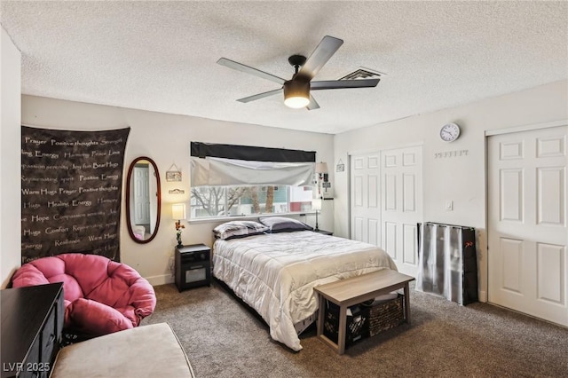 carpeted bedroom featuring a closet, ceiling fan, and a textured ceiling