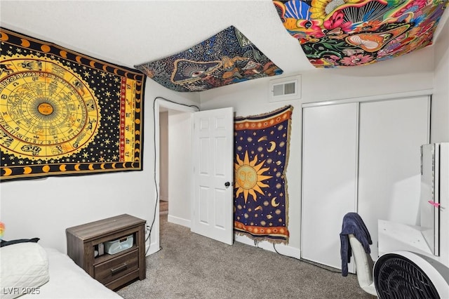 carpeted bedroom featuring a closet