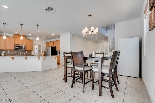 dining room featuring visible vents, recessed lighting, stairway, an inviting chandelier, and light tile patterned floors