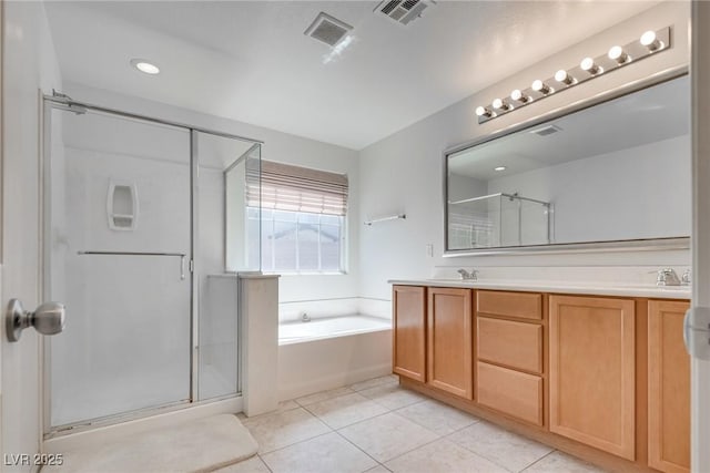 full bath with tile patterned flooring, a garden tub, visible vents, and a stall shower